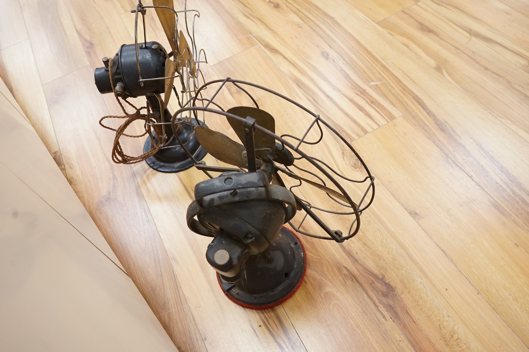 Two early 20th century electric fans, one by General Electric, 43cm high
